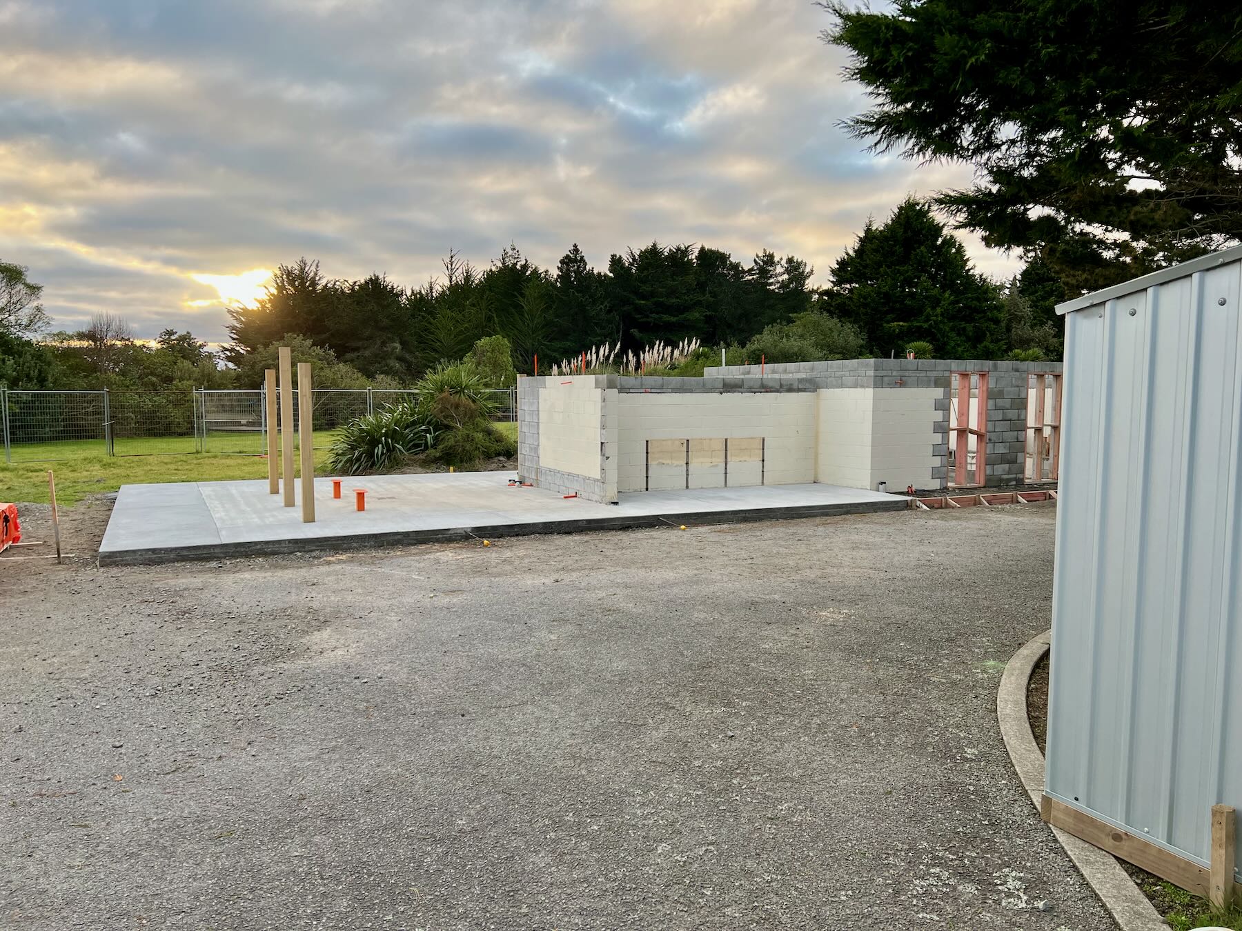 South end of the toilet block with extended concrete pad and added wall height. 